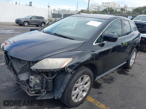 2009 Mazda CX-7 Grand Touring with VIN JM3ER29L990234727, listed as a IAAI auction lot 41272921 with 173,753 mi miles. Bid and sale history available at carsss.com. Image 2.