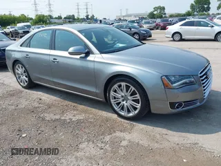 2013 Audi A8 4.0L with VIN WAUA2AFD5DN021950, listed as a IAAI auction lot 42472512 with 126,964 mi miles and . Bid and sale history available at DreamBid. Image 1.