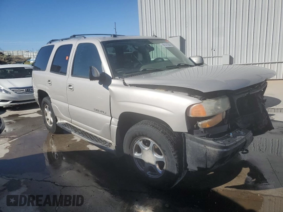 2005 GMC Yukon Denali z VIN 1GKEK63U35J228887, wystawiony jako Copart lot #68141304 z przebiegiem 238 024 mil mil oraz Szkoda całkowita • Salvage title. Historia ofert i sprzedaży dostępna na DreamBid. Obrazek 4.