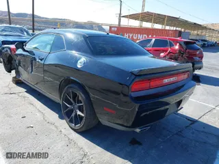 2013 Dodge Challenger R/T with VIN 2C3CDYBT4DH517881, listed as a IAAI auction lot 41422647 with 76,889 mi miles. Bid and sale history available at carsss.com. Image 3.