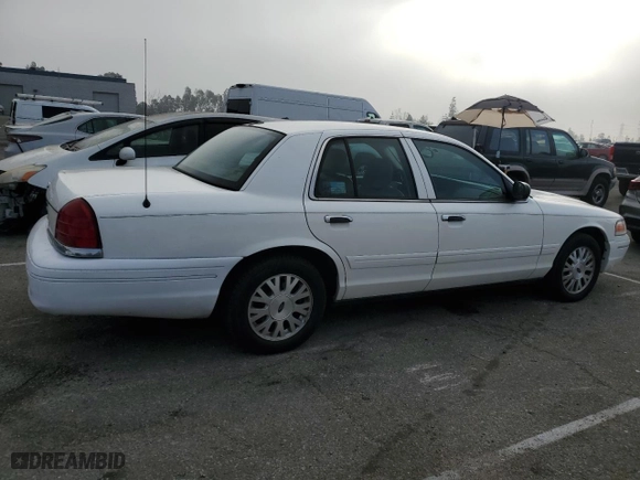 2005 Ford Crown Victoria LX with VIN 2FAFP74W95X124697, listed as a Copart auction lot 86931404 with 303,132 mi miles and Clean Title. Bid and sale history available at carsss.com. Image 3.