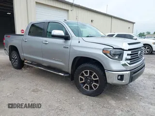 2019 Toyota Tundra SR5 z VIN 5TFHY5F1XKX797358, wystawiony jako IAAI lot #42123409 z przebiegiem 217 075 mil mil oraz . Historia ofert i sprzedaży dostępna na DreamBid. Obrazek 1.