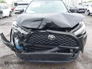 2022 Toyota Corolla Cross LE with VIN 7MUCAABG8NV004527, listed as a IAAI auction lot 42259519 with 15,211 mi miles and . Bid and sale history available at DreamBid. Image 6.