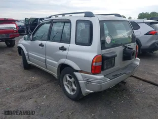 2000 Suzuki Grand Vitara JLX with VIN JS3TD62V5Y4117740, listed as a IAAI auction lot 42088696 with 166,484 mi miles. Bid and sale history available at carsss.com. Image 3.