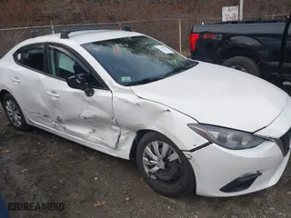 2014 Mazda Mazda3 i Sport with VIN JM1BM1U75E1130979, listed as a IAAI auction lot 41094791 with 100,518 mi miles. Bid and sale history available at carsss.com. Image 6.