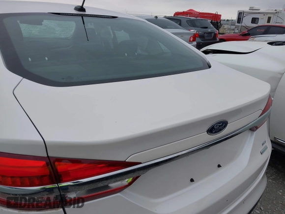 2018 Ford Fusion SE z VIN 3FA6P0HD9JR231970, wystawiony jako IAAI lot #41549490 z przebiegiem 99 803 mil mil oraz . Historia ofert i sprzedaży dostępna na DreamBid. Obrazek 20.