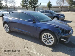 2023 Tesla Model 3 Long Range with VIN 5YJ3E1EB3PF633070, listed as a Copart auction lot 48942545 with 38,332 mi miles and Salvage Title. Bid and sale history available at DreamBid. Image 4.