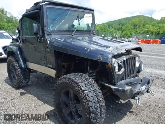 2003 Jeep Wrangler Sport z VIN 1J4FA49S53P317779, wystawiony jako IAAI lot #42388780 z przebiegiem Nie podano mil oraz . Historia ofert i sprzedaży dostępna na DreamBid. Obrazek 1.