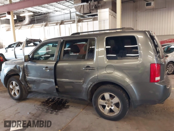 2011 Honda Pilot EX-L with VIN 5FNYF4H65BB020721, listed as a IAAI auction lot 41794436 with 113,630 mi miles and . Bid and sale history available at carsss.com. Image 14.