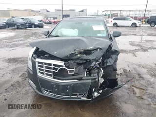 2013 Cadillac XTS Luxury z VIN 2G61R5S35D9100771, wystawiony jako IAAI lot #41673766 z przebiegiem 41 123 mil mil oraz . Historia ofert i sprzedaży dostępna na DreamBid. Obrazek 6.