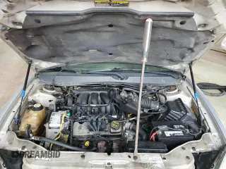 2005 Ford Taurus SE with VIN 1FAFP53215A133518, listed as a Copart auction lot 59615205 with 127,778 mi miles and Salvage title. Bid and sale history available at DreamBid. Image 11.