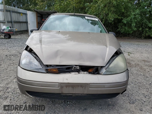 2004 Ford Focus LX with VIN 1FAFP33P24W148563, listed as a Copart auction lot 63869755 with 142,243 mi miles and Salvage title. Bid and sale history available at DreamBid. Image 5.