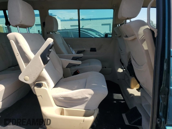 2003 Volkswagen EuroVan с VIN WV2KB47043H001319, выставлен на аукционе Copart как лот 73758024 с пробегом 88 497 миль миль и Чистый • Clean title. История ставок и продаж доступна на DreamBid. Изображение 11.