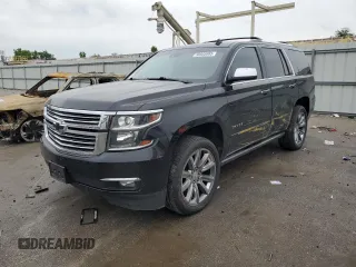 2015 Chevrolet Tahoe LTZ with VIN 1GNSKCKCXFR203596, listed as a Copart auction lot 58503985 with 128,553 mi miles and Salvage title. Bid and sale history available at DreamBid. Image 1.