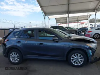2014 Mazda CX-5 Touring with VIN JM3KE2CY9E0384401, listed as a IAAI auction lot 41699913 with 75,301 mi miles. Bid and sale history available at carsss.com. Image 13.