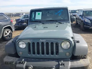 2014 Jeep Wrangler Unlimited Sport with VIN 1C4BJWDG9EL309763, listed as a IAAI auction lot 41378132 with 117,029 mi miles. Bid and sale history available at carsss.com. Image 12.