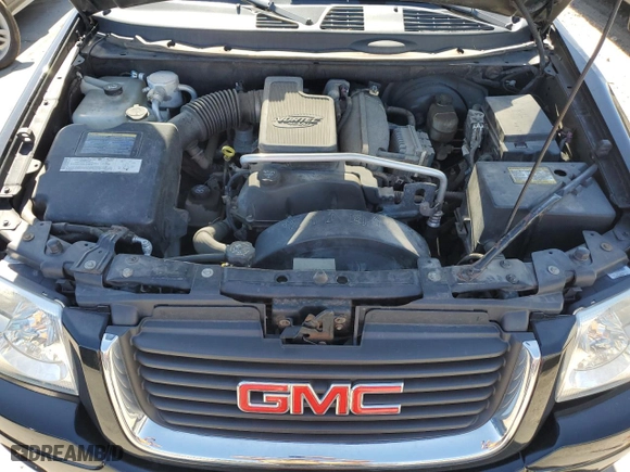 2005 GMC Envoy SLE with VIN 1GKDT13S752390266, listed as a Copart auction lot 50766935 with 115,225 mi miles and Salvage Title. Bid and sale history available at carsss.com. Image 13.