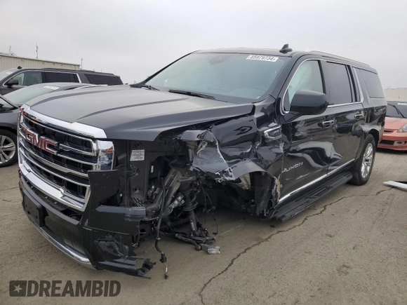 2023 GMC Yukon XL SLT with VIN 1GKS2GKD5PR363433, listed as a Copart auction lot 85979734 with 61,957 mi miles and Salvage Title. Bid and sale history available at DreamBid. Image 1.