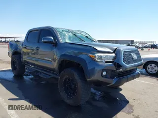 2019 Toyota Tacoma SR with VIN 3TMCZ5AN7KM239216, listed as a IAAI auction lot 42438852 with 153,488 mi miles and . Bid and sale history available at DreamBid. Image 1.