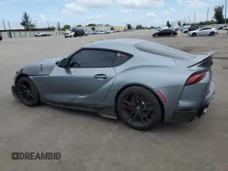 2022 Toyota Supra 3.0 with VIN WZ1DB0C09NW047931, listed as a Copart auction lot 59527955 with 61,941 mi miles and Salvage title. Bid and sale history available at DreamBid. Image 2.