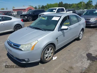 2008 Ford Focus SE with VIN 1FAHP35N88W271973, listed as a IAAI auction lot 42090204 with 261,457 mi miles. Bid and sale history available at carsss.com. Image 2.