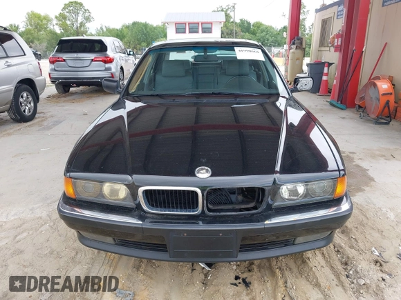 1997 BMW 7 Series 740il with VIN WBAGJ8324VDL43320, listed as a IAAI auction lot 41990660 with 193,998 mi miles. Bid and sale history available at carsss.com. Image 6.