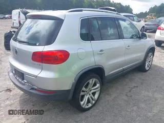 2013 Volkswagen Tiguan S with VIN WVGAV3AX9DW566269, listed as a IAAI auction lot 42728301 with 159,903 mi miles and . Bid and sale history available at DreamBid. Image 4.
