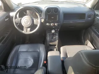 2015 Jeep Patriot High Altitude with VIN 1C4NJRFBXFD272296, listed as a Copart auction lot 62051095 with 118,496 mi miles and Salvage title. Bid and sale history available at DreamBid. Image 8.