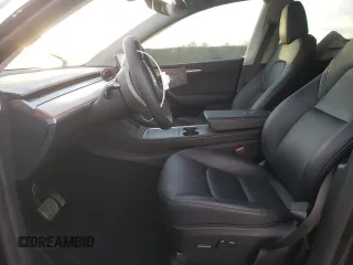 2024 Tesla Model Y Long Range with VIN 7SAYGAEE5RF038446, listed as a Copart auction lot 48868025 with 10,410 mi miles and Salvage Title. Bid and sale history available at DreamBid. Image 7.