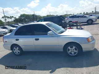 2002 Hyundai Accent GL with VIN KMHCG45C82U268756, listed as a IAAI auction lot 41569829 with 89,752 mi miles. Bid and sale history available at carsss.com. Image 13.