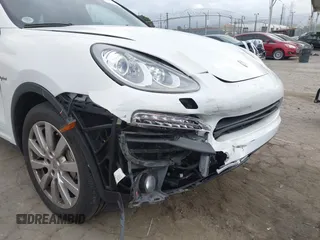 2014 Porsche Cayenne S Hybrid with VIN WP1AE2A28ELA51123, listed as a IAAI auction lot 42091475 with 41,341 mi miles and . Bid and sale history available at DreamBid. Image 6.