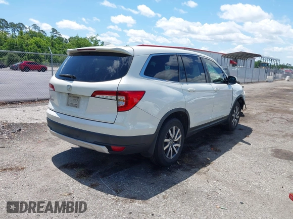 2019 Honda Pilot EX-L with VIN 5FNYF5H42KB026108, listed as a IAAI auction lot 42387593 with 112,556 mi miles and . Bid and sale history available at DreamBid. Image 4.