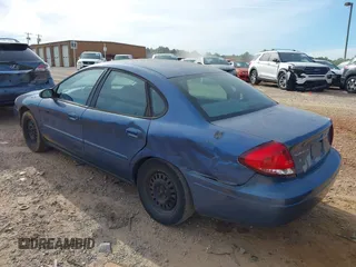 2004 Ford Taurus LX z VIN 1FAFP52U64A114884, wystawiony jako IAAI lot #42212573 z przebiegiem 106 402 mil mil oraz . Historia ofert i sprzedaży dostępna na DreamBid. Obrazek 3.