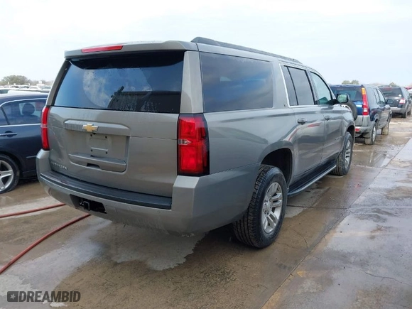 2019 Chevrolet Suburban LT with VIN 1GNSCHKC7KR137304, listed as a IAAI auction lot 41559622 with 100,595 mi miles. Bid and sale history available at carsss.com. Image 4.