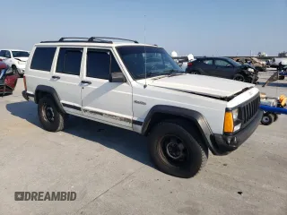 1996 Jeep Cherokee SE with VIN 1J4FT28S3TL197827, listed as a Copart auction lot 75443574 with 116,660 mi miles and Salvage Title. Bid and sale history available at carsss.com. Image 4.