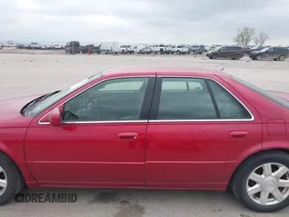 2001 Cadillac Seville z VIN 1G8KS54Y91U227846, wystawiony jako IAAI lot #42134095 z przebiegiem 216 766 mil mil oraz . Historia ofert i sprzedaży dostępna na DreamBid. Obrazek 14.