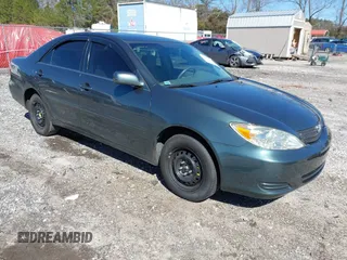 2002 Toyota Camry LE z VIN 4T1BE32K52U566303, wystawiony jako IAAI lot #41602677 z przebiegiem 205 673 mil mil oraz . Historia ofert i sprzedaży dostępna na DreamBid. Obrazek 1.