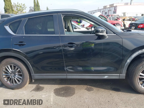 2021 Mazda CX-5 Touring with VIN JM3KFACM2M0339349, listed as a IAAI auction lot 41651005 with 53,792 mi miles. Bid and sale history available at carsss.com. Image 13.