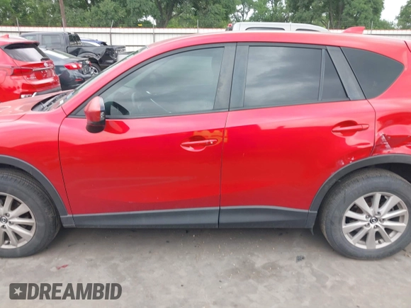 2015 Mazda CX-5 Touring with VIN JM3KE4CYXF0439953, listed as a IAAI auction lot 42124197 with 242,614 mi miles and . Bid and sale history available at DreamBid. Image 14.