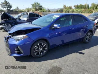2019 Toyota Corolla L with VIN 5YFBURHE8KP868726, listed as a Copart auction lot 61821575 with 90,449 mi miles and Salvage title. Bid and sale history available at DreamBid. Image 1.
