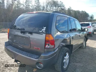 2007 GMC Envoy SLE with VIN 1GKDS13S372241844, listed as a IAAI auction lot 41575443 with 144,726 mi miles. Bid and sale history available at carsss.com. Image 4.