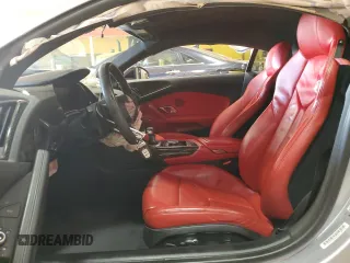 2018 Audi R8 V10 z VIN WUABAAFX7J7902267, wystawiony jako Copart lot #44403794 z przebiegiem Nie podano mil oraz Szkoda całkowita • Salvage title. Historia ofert i sprzedaży dostępna na DreamBid. Obrazek 7.