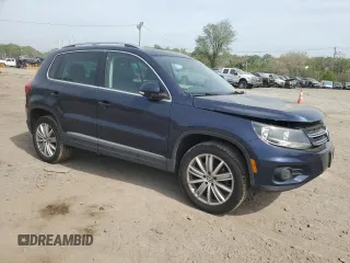 2012 Volkswagen Tiguan S with VIN WVGBV7AX1CW561870, listed as a Copart auction lot 53932255 with 105,972 mi miles and Salvage Title. Bid and sale history available at DreamBid. Image 4.