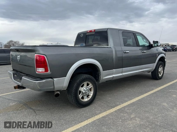 2013 Ram 2500 Laramie with VIN 3C6UR5NL5DG517102, listed as a IAAI auction lot 41970605 with 203,697 mi miles and . Bid and sale history available at carsss.com. Image 1.