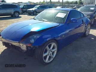 2004 Nissan 350Z Touring with VIN JN1AZ34D34T165329, listed as a IAAI auction lot 41872788 with 199,196 mi miles. Bid and sale history available at carsss.com. Image 2.