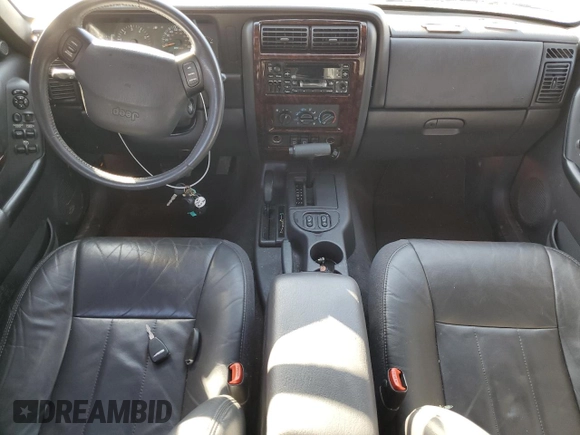 2001 Jeep Cherokee Sport z VIN 1J4FF58S61L612533, wystawiony jako Copart lot #76824714 z przebiegiem 62 401 mil mil oraz Szkoda całkowita • Salvage title. Historia ofert i sprzedaży dostępna na DreamBid. Obrazek 8.