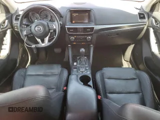 2016 Mazda CX-5 Grand Touring z VIN JM3KE2DYXG0840777, wystawiony jako Copart lot #49700585 z przebiegiem 116 469 mil mil oraz Szkoda całkowita • Salvage title. Historia ofert i sprzedaży dostępna na DreamBid. Obrazek 8.