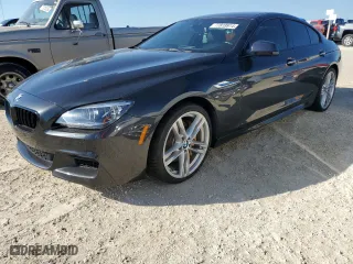 2015 BMW 6 Series 650i with VIN WBA6B2C58FD799063, listed as a Copart auction lot 77819914 with 0 mi miles and Salvage Title. Bid and sale history available at carsss.com. Image 1.
