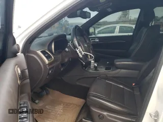 2015 Jeep Grand Cherokee Summit with VIN 1C4RJEJG8FC131925, listed as a Copart auction lot 55270785 with 130,425 mi miles and Salvage title. Bid and sale history available at DreamBid. Image 7.