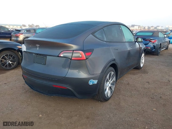 2021 Tesla Model Y Standard Range with VIN 5YJYGDED4MF121963, listed as a IAAI auction lot 41490477 with 41,941 mi miles. Bid and sale history available at carsss.com. Image 4.